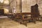 Interior of ancient medieval church. Empty church with benches and confessional. Historic abbey hall. Faith and religion concept.