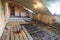 Interior of apartment during on the renovation and construction. Chainsaw on partially dismantled wooden floor and sawdust