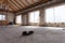 Interior of apartment during under renovation, remodeling and construction a pair of working shoes on the cement floor