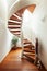 Interior of apartment with wooden spiral staircase