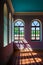 The interior of the Assumption-Bogoroditsky Monastery. Arched windows, rays of light and bright wall colors. Sviyazhsk. Kazan.