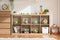 Interior of baby or child room with toys in cozy and warmth home. Nursery room with colorful toys in wooden box for development