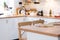 Interior background in a blur of white wooden kitchen of Festive Christmas decor and mess, festive breakfast, white scandi