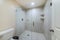 Interior of a bathroom with frameless shower stall