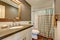 Interior of bathroom . Grey walls with white tile wall trim