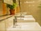 Interior of bathroom with sink basin faucet.