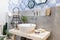 Interior of bathroom with sink basin faucet and mirror. Modern d