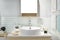 Interior of bathroom with sink basin faucet and mirror. Modern d