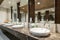 Interior of bathroom with washbasin faucet and black towel in ho