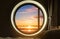 Interior bedroom circle window with beautiful sunrise view