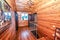 Interior of the bedroom in a wooden village house is made of birch timber-clapboard