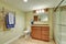 Interior of beige bathroom with modern vanity cabinet