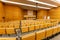 Interior of big conference hall full of gray folding chairs