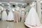 Interior of bridal salon, wedding dresses on mannequins