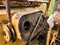 Interior of cabin with levers and instruments panel of abandoned deserted old rusty bulldozer, vintage industrial heavy machine,