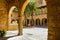 Interior of the cathedral of Mallorca with patio and stone arches.