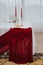 Interior of ceremony room with table covered by red and white tablecloth