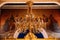 Interior of Church of the Holy Annunciation in the old town of Dubrovnik, Croatia. Golden chandelier with bulbs.