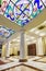 Interior of the columned hall with a chandelier