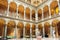 Interior of courtyard of Museum of Applied Arts with stone columns and couches