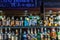 Interior of cozy pub or coffee shop or cafe with bottles of spirits on shelves