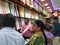 Interior Design Cloth Store and Colorful Men shirt, pant, saree and blouse rolled and well arranged in a shelf