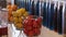 Interior design with colorful decorative glass bottles and fruits on tabletop