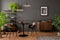 Interior design of living room interior with mock up poster frame, round black coffee table, wooden sideboard, stylish chair,