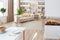 Interior design spacious bright studio apartment in Scandinavian style and warm pastel white and beige colors. trendy furniture in