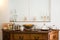 Interior detail with antique cabinet and exquisite ceramic, glass and metal dishes