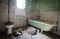 Interior of a dirty abandoned bathroom