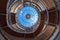 Interior dome, spiral staircase and flags of different countries in Chess Palace in the city of chess in Elista. Russia