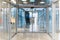 Interior of elevated pedestrian glass tunnel in airport