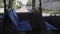 Interior of an empty bus with blue seats on a route in Munich. The topic of public urban transport in the Bavarian