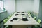 interior of empty classroom with laptops on desk at stem