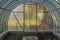 Interior of empty greenhouse before spring with concrete walls