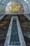 Interior of empty greenhouse before spring with concrete walls