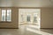 Interior of the empty living room in the cottage with tiled floors and large windows. Sunny interior