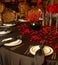 Interior festive table evening dinner candlelight red