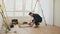 Interior finishing worker, tiler or handyman, using manual tile cutter. Industrial tiler builder worker working with