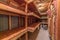 Interior of food cold storage with wooden racks and insulated wall and ceiling