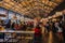 Interior of food court in Porto. Crowd of tourists eating in cafes. Urban food court in Porto. Portuguese cuisine concept.