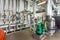 Interior gas boiler room with multiple pumps and piping