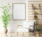 Interior with gray armchair and ladder shelf in modern living room with wooden panelling and mockup poster on the wall, home