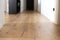 Interior home view. wooden board of a parquet with black veins, oak parquet, details of the intersection of three boards with