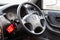 Interior of a Honda car inside with a view of the steering wheel and dashboard after cleaning and dry cleaning before selling in