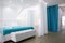 The interior of the hotel room is in white and blue tones. Large bed with a white canopy or curtain. Photos in the interior