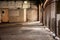 Interior of industrial grungy garage with gates.