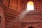 Interior of Jama Masjid with a beam of light coming through the