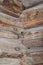 Interior joints of an old log cabin with numbers indicated it has been dissembled, moved, and reassembled an